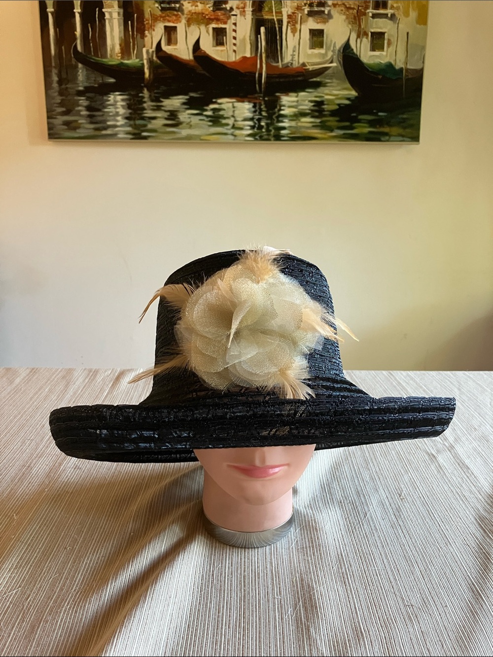 Elegant Black Wide-Brim Hat with Cream Floral Feathered Accent